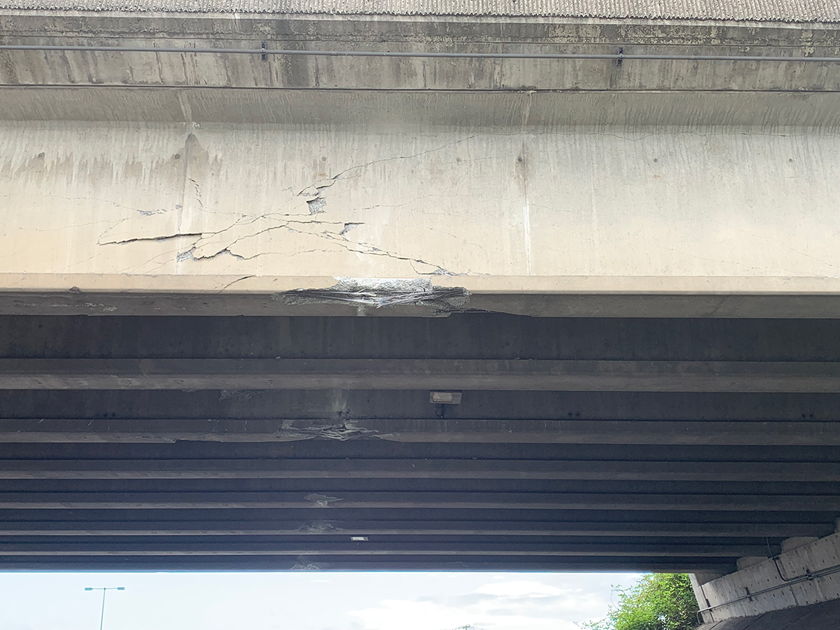 Bridge strike damage on underside of Lind Ave bridge