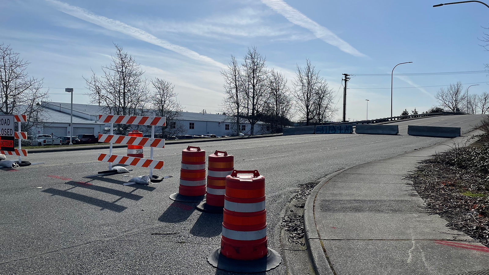 Road closure of Lind Ave at SW 12th Street in Renton with detour sign