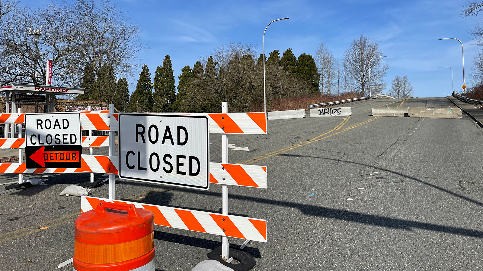 Road closure of Lind Ave at SW 12th Street in Renton with detour sign