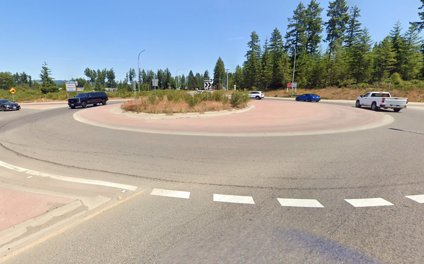 Photographic example of the street view with a similar roundabout located in downtown Shelton, at the intersection of Logyard Road and State Route 3 near Belfair.