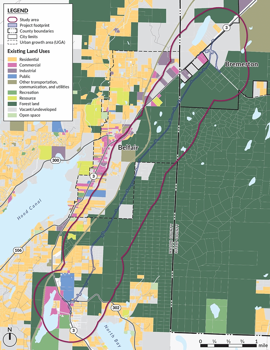 A map of the area with property lines. The map shows the project area along with the land use for each area. Most of the right half of the map is forest land. As it moves towards the middle and left, colors for residential and commercial are shown. Most of the proposed new highway goes through forest land or the edge of residential areas.