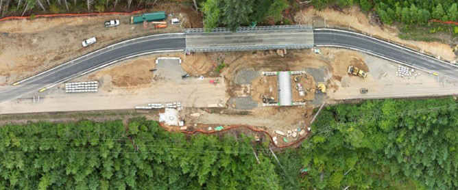 Bird’s eye view of work zone with temporary road that carries traffic around construction area.