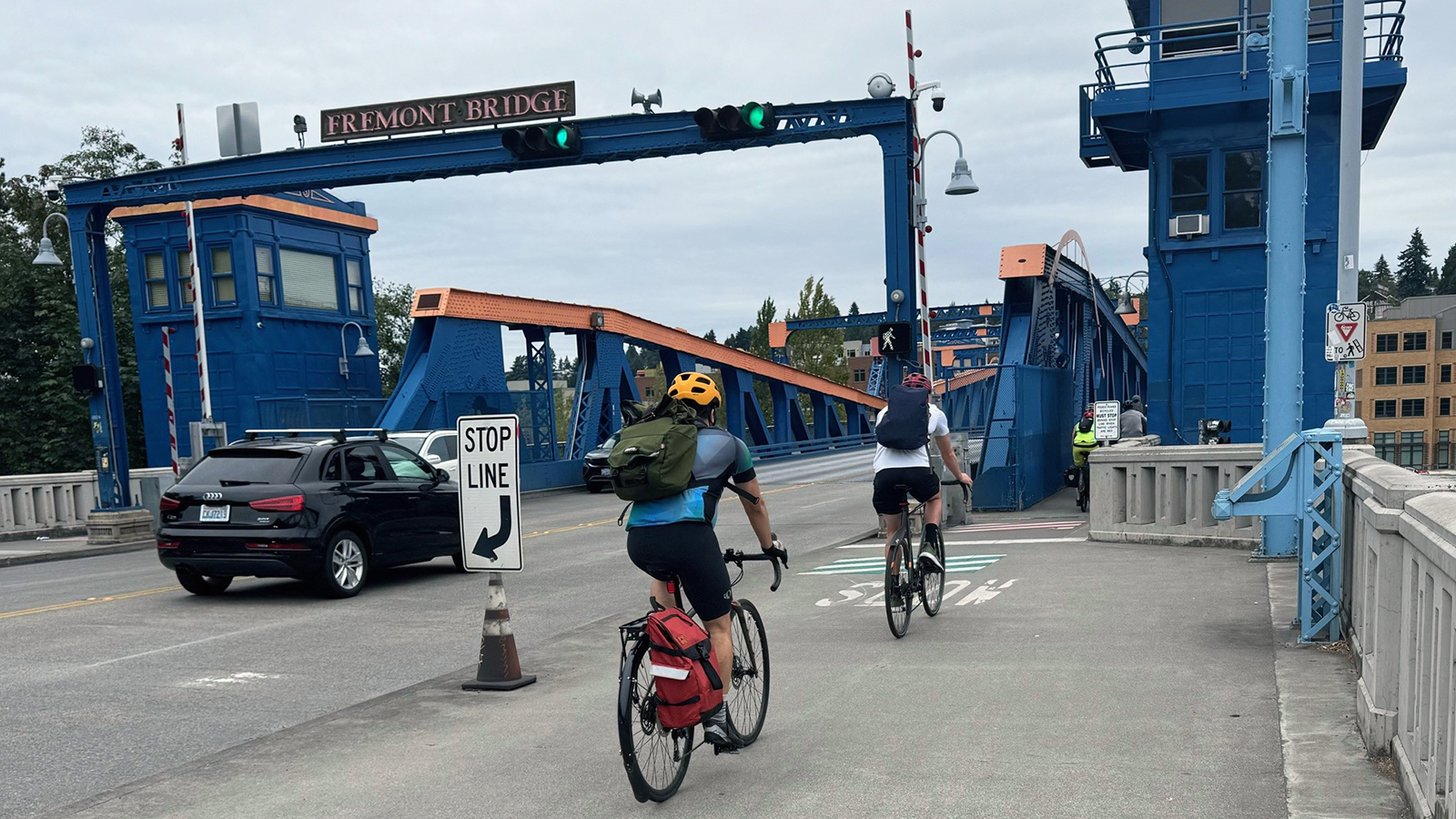 Bicyclists riding onto the Freemont Bridge