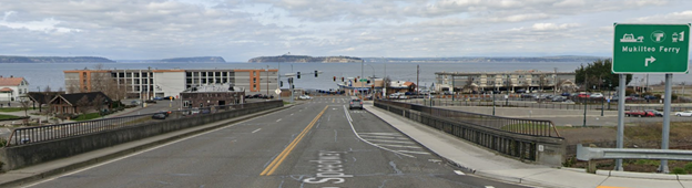 An image of the SR 525 Mukilteo Bridge over the BNSF railroad, looking north towards the Puget Sound.