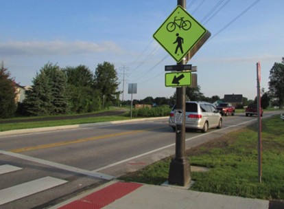 An image of a rectangular rapid flashing beacon near a crosswalk