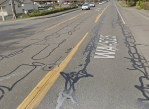 An image showing a section of SR 525 with worn pavement.